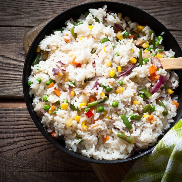 Rice with vegetables in a pan. Rustic Style.